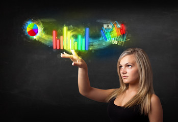 Young businesswoman touching colorful modern graph system concep