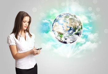 Young woman with earth and cloud concept