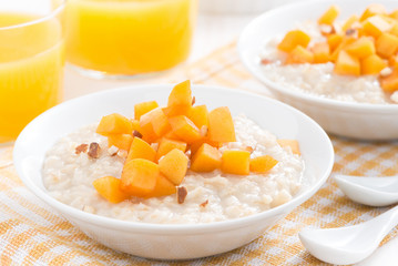 bowl of oatmeal with fresh apricots and orange juice