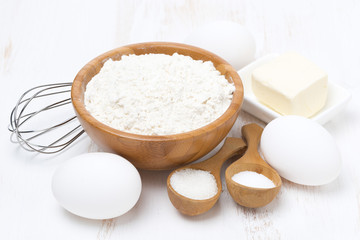 flour, salt, sugar, butter and eggs for baking pancakes