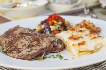 A la carte steak meal on patterned plate