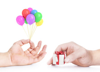 Hand holds colorful balloons isolated on white