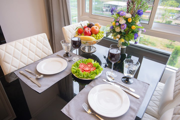 The table set and a glass of wine