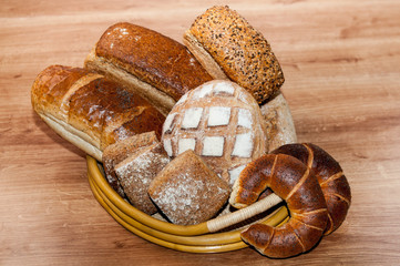 Group of different breads type on wooden table
