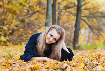 young woman in yellow autumn park