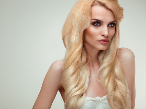 Blonde Hair. Portrait of beautiful blonde with Healthy Long Hair