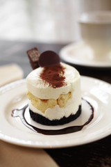 close up vanilla cake and chocolate sauce in coffee shop