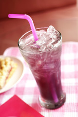 close up cold grape juice in glass