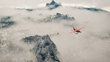 Red airplane flying over snow mountains with pine trees in the c