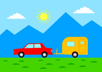 Car with caravan in mountainous landscape