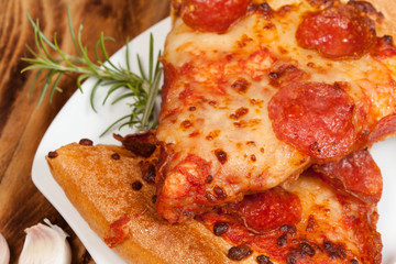 Two pieces of pizza.