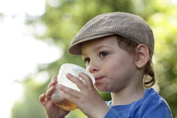 Kid with cup of tea