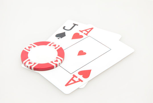 Jack and ace blackjack hand cards with chip on white background