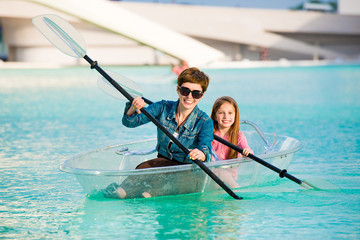 little girl with mother kayak