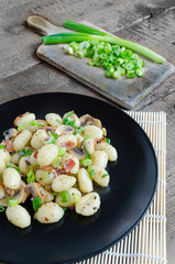 Gnocchi pasta with ham, spring onion