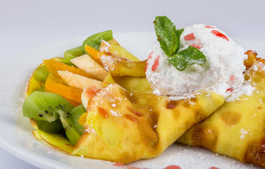 sweet pancakes with fruit and ice cream