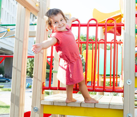 cute happy child girl on playground