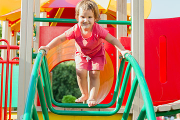 Fototapeta na wymiar cute happy child girl on playground