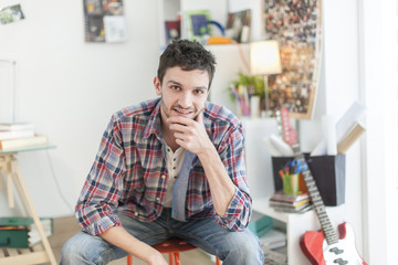 Fototapeta premium portrait of an handsome young man in his flat