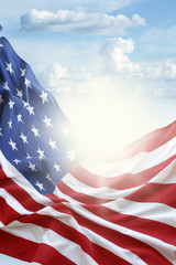 American flag in blue sky