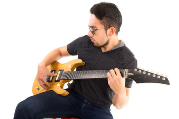 hispanic young man playing electric guitar