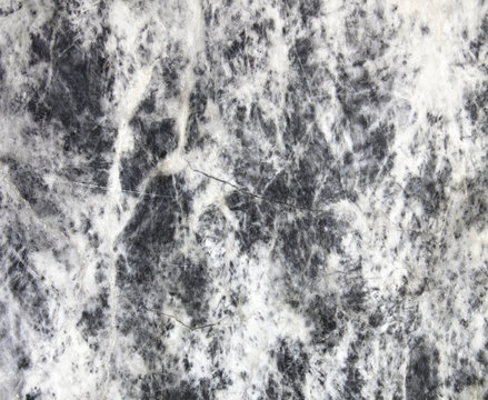 Surface of natural gray spotted stone as background