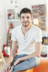 portrait of an handsome young man at home