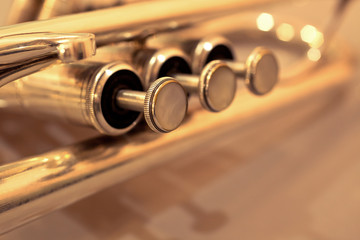 Detail of trumpet closeup in golden tones