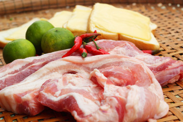 Streaky pork in the basket - for cooking.