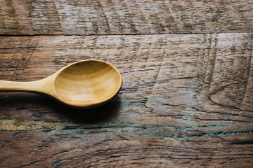 wood spoon on wooden table close up