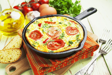 Omelet with vegetables and cheese. Frittata