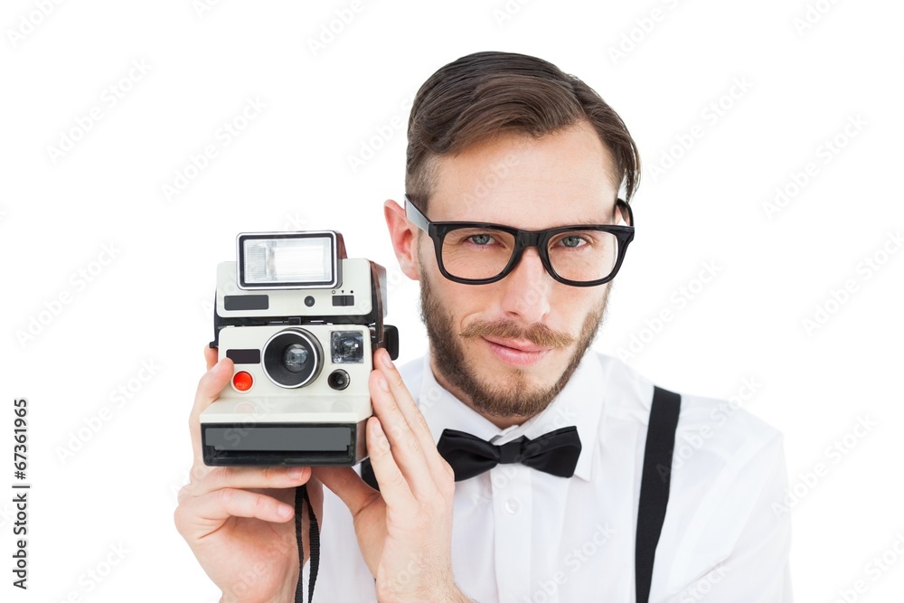 Poster geeky hipster holding a retro camera