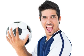 Fotobehang Happy football player in blue holding the ball © WavebreakMediaMicro
