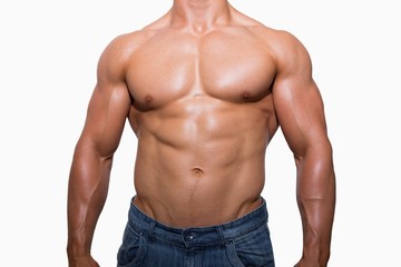 Fototapeta premium Mid section of a shirtless muscular man