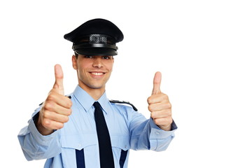 Smiling young policeman shows you thumbs up
