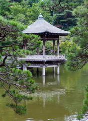 Japan. Narita. pavilion on the lake in park..