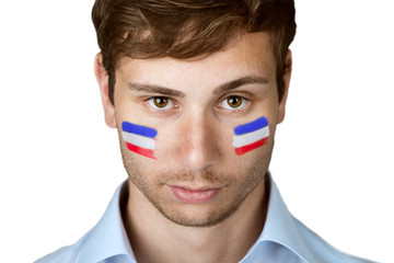 soccer fan with netherlands flag painted at the face