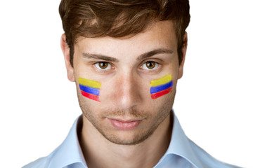 soccer fan with colombia flag painted at the face