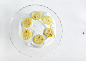 Vanilla and lemon cake with butter cream icing and candied lemon