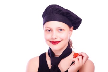 Teen girl eating tomato