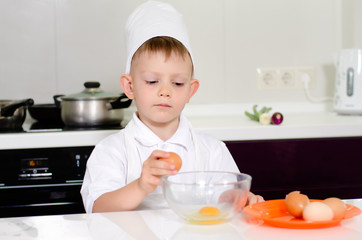 Young boy earning to be a chef