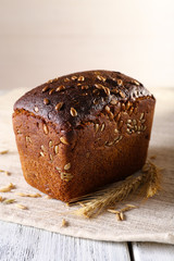 Fresh bread on wooden table, close up