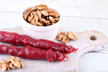 Tasty oriental sweets (churchkhela) and fresh nuts,