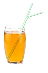 Apple juice in a glass with drinking straws