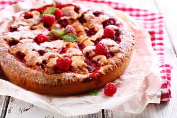 Tasty cake with berries on table close-up