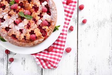 Fototapeta na wymiar Tasty cake with berries on table close-up