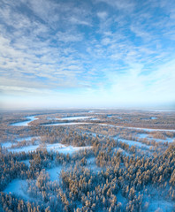 Top view of trees in hoar beside forest river in winter