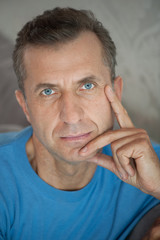 Mature man thinking - close portrait