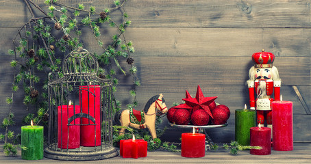 christmas decorations with red candles and vintage toys
