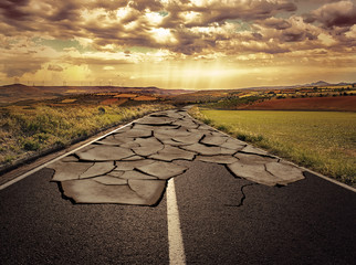 Asphalt road with cracks. Concept of problem and solution. - 67374732
